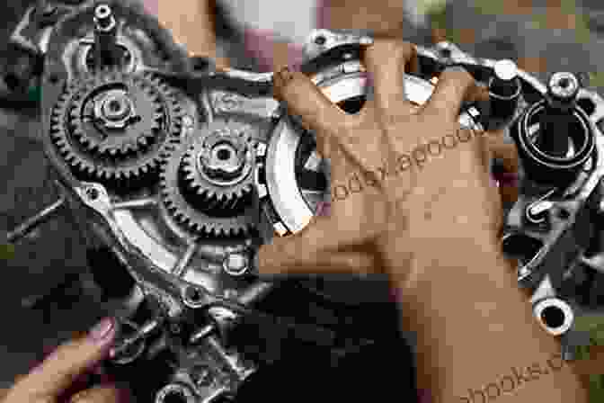 A Person Performing Advanced Repairs On A Motorcycle, Removing The Engine Head. The Zen Of Motorcycle Maintenance: Essential Guide To Motorcycle Maintenance Discover How To Make Your Motorcycle Last Forever (Mechanics Street Rides)