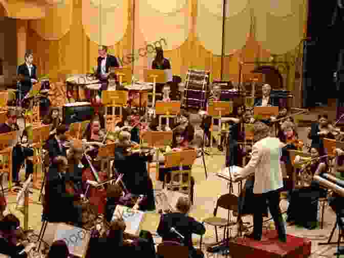 A Person Sitting In A Concert Hall, Attentively Listening To A Classical Music Performance. A Young Person S Guide To Classical Music