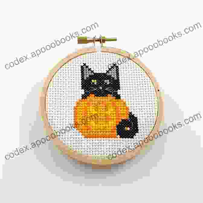 A Pumpkin Cross Stitch Hanging On A Wall Halloween Cross Stitch Patterns: 5 Festive Cross Stitch Patterns