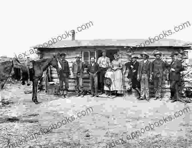 An Old Photograph Depicting A Pioneer Family Standing In Front Of A Log Cabin Legendary Locals Of Cullman County